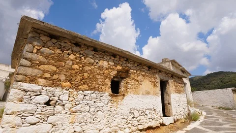 Old village stone building without windows and doors in doorway Stock Footage 103676611