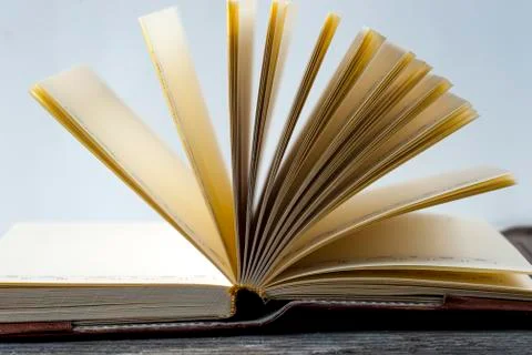 Old vintage books on table on rustic wooden background Stock Photos