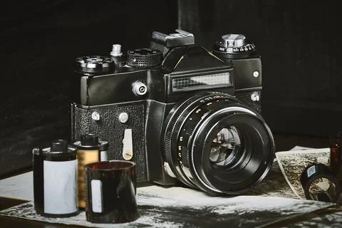 Old vintage camera close up, rolls of film, old photos, tinted shot, floating Stock Photos