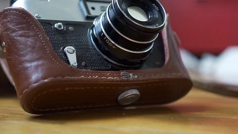 Old vintage camera on the wood Stock Footage 90022963