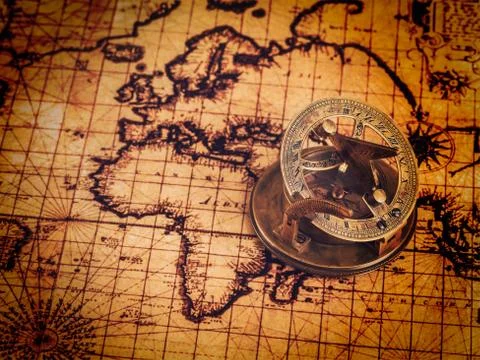 Old vintage compass on ancient map Stock Photos