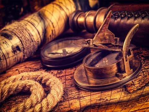 Old vintage compass on ancient map Stock Photos