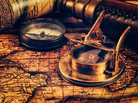Old vintage compass on ancient map Stock Photos