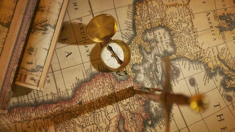 Old vintage compass lying on the ancient map. Used in sailing for navigation. Stock Footage