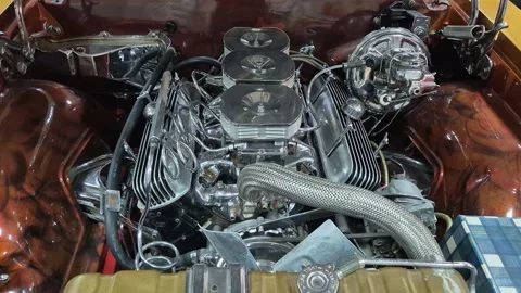 Old vintage engine of a presentable car from the 60s or 70s. Stock Footage 309676317