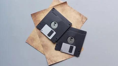 An old vintage floppy disk on a gray background. Stock Footage 222979837