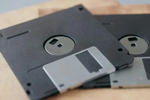 An old vintage floppy disk on a gray background. 스톡 사진