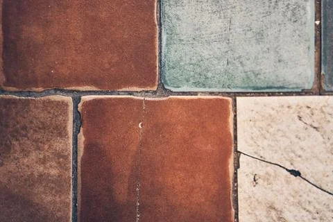 Old vintage, geometric patchwork mosaic ornament, tile. Texture of stone tiles 库存照片
