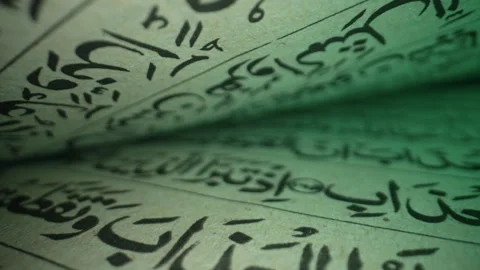 Old Vintage Handwritten Calligraphy Scriptures Of Muslim Holy Book. Exploring Stock Footage 288040292