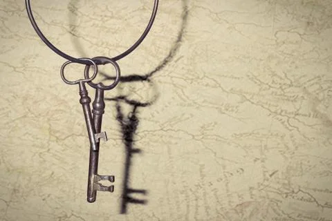 Old vintage key on rustic background Stock Photos