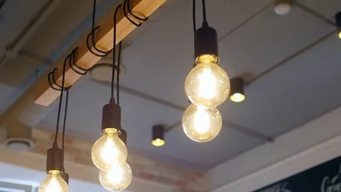 Old vintage light bulb. Set of vintage glowing light bulbs on black. light bulbs Stock Footage 77994093
