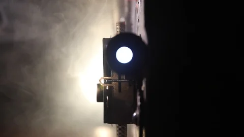 Old vintage movie projector on a dark background with fog and light Stock Footage 105964201