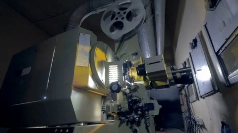 Old, vintage movie projector working in the dark. 4K. Stock Footage 80667009