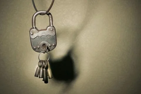 Old vintage padlock on rustic background Stock Photos