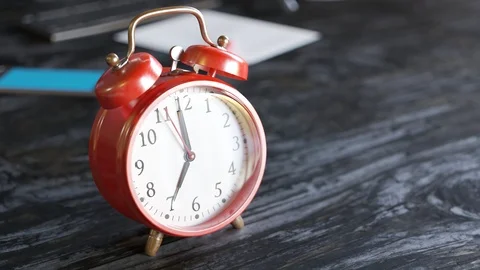 "Old vintage red alarm clock shaking and ringing on an office desk. 4KHD" Stock Footage 97959848