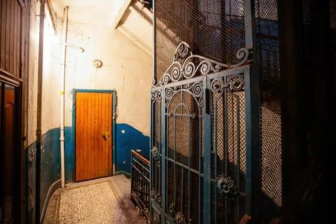 Old vintage rusty elevator gates in old mansion Stock Photos