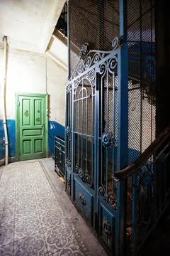 Old vintage rusty elevator gates in old mansion Stock Photos