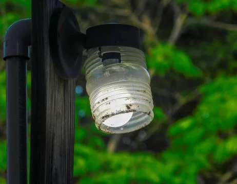 Old Vintage Shed light on a wooden post Stock Photos
