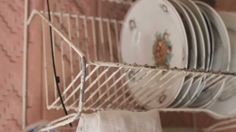 Old vintage tableware on old drainer in countryside house, Belarus Stock Footage 99489576