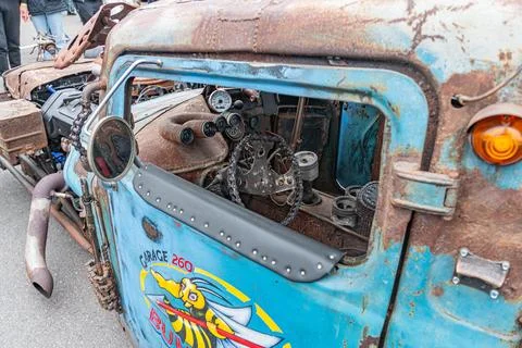 An old, vintage truck with structural modifications and graffiti art is part  Stock Photos