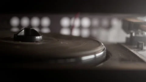 Old vintage turntable is spinning without vinyl record. Retro player of broken Stock Footage 236796698