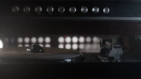Old vintage turntable is spinning without vinyl record. Retro player of broken Stock Footage 237196671