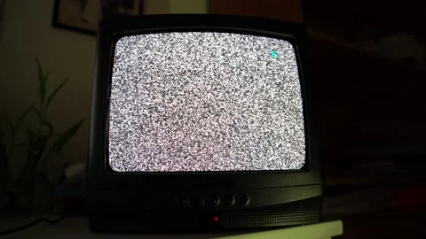 Old vintage TV transmission in dark room, flicking retro TV screen with noise Stock Footage