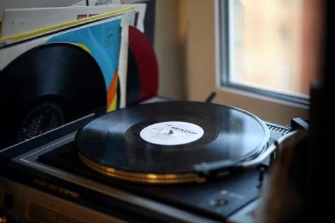 Old vinyl player on the window Stock Photos