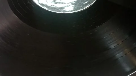 Old vinyl record player spinning retro music disc in vintage style Stock Footage 338414627