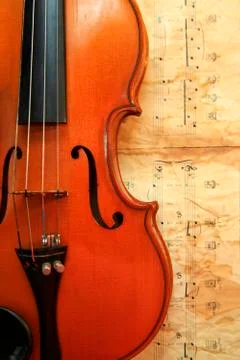 Old violin on the background of notes Stock Photos