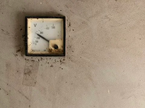 Old Voltage meter gauge horizontal photo. Stock Photos