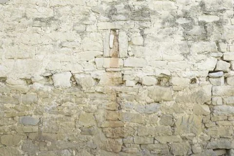 Old wall and broken stone in urban street construction 스톡 사진
