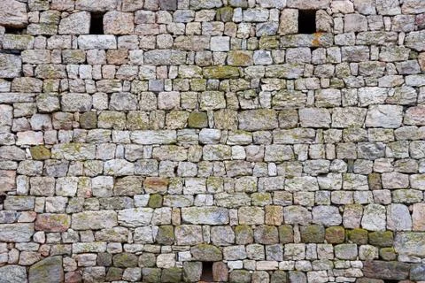 Old wall background. Old irregular stone pattern Stock Photos