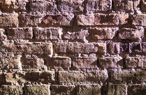 Old wall background with stained aged bricks Old urban textured background Stock Photos