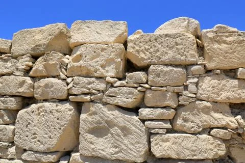 Old wall on blue sky background Stock Photos