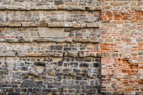 Old wall with brickwork of different bricks on the 16 century in Florence Stock Photos