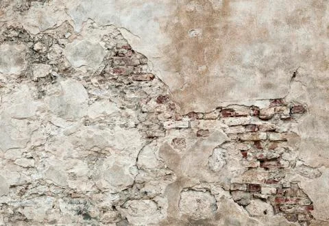 Old wall with brickwork under plaster Stock Photos