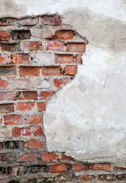 Old wall with brickwork under plaster Stock Photos