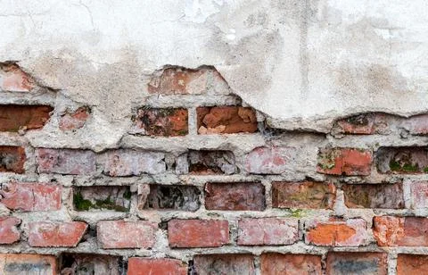 Old wall with brickwork under plaster Stock Photos