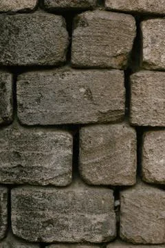 Old wall build of sandstone bricks background texture Stock Photos