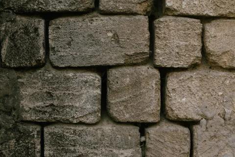 Old wall built of sandstone brick background texture Stock Photos