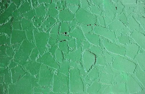 Old wall at the bus stop, painted green paint on top of the cladding tiles... Stock-Fotos