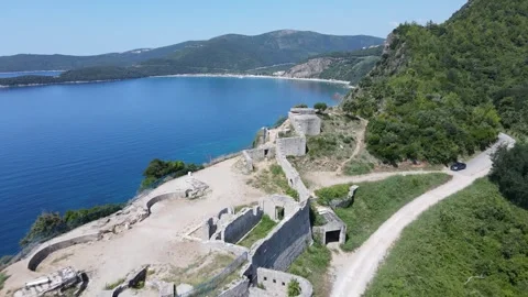 Old wall on cliff side in Montenegro - aerial 4K Stock Footage 252464623