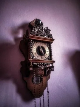 Old wall clock with pendulum Stock Photos