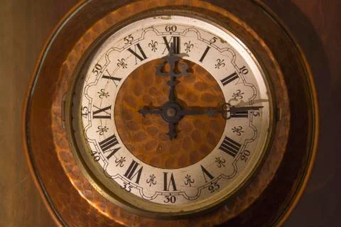 Old wall clock with roman numerals Stock Photos