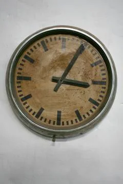 Old wall clock on white Foto stock