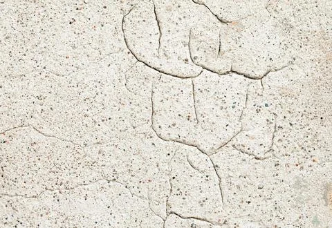 Old wall covered with cement plaster with deep cracks Stock Photos