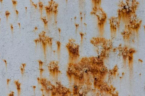 Old wall with cracks and rust. Textured wall damaged by time. Stock Photos