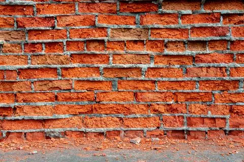 Old wall with crumbling red bricks 写真素材