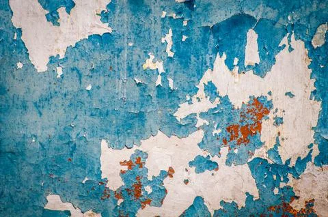 Old wall with dried, damaged very old paint. Texture, background. Stock Photos